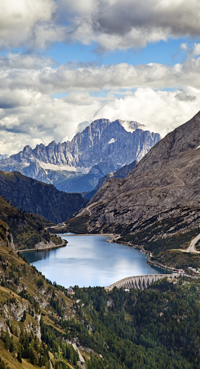 Fedaia lake in Dolomites with view of Marmolada mountain.