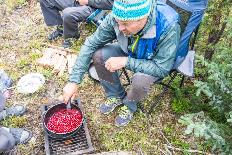 A man preparing a meal along the Hawkrock River