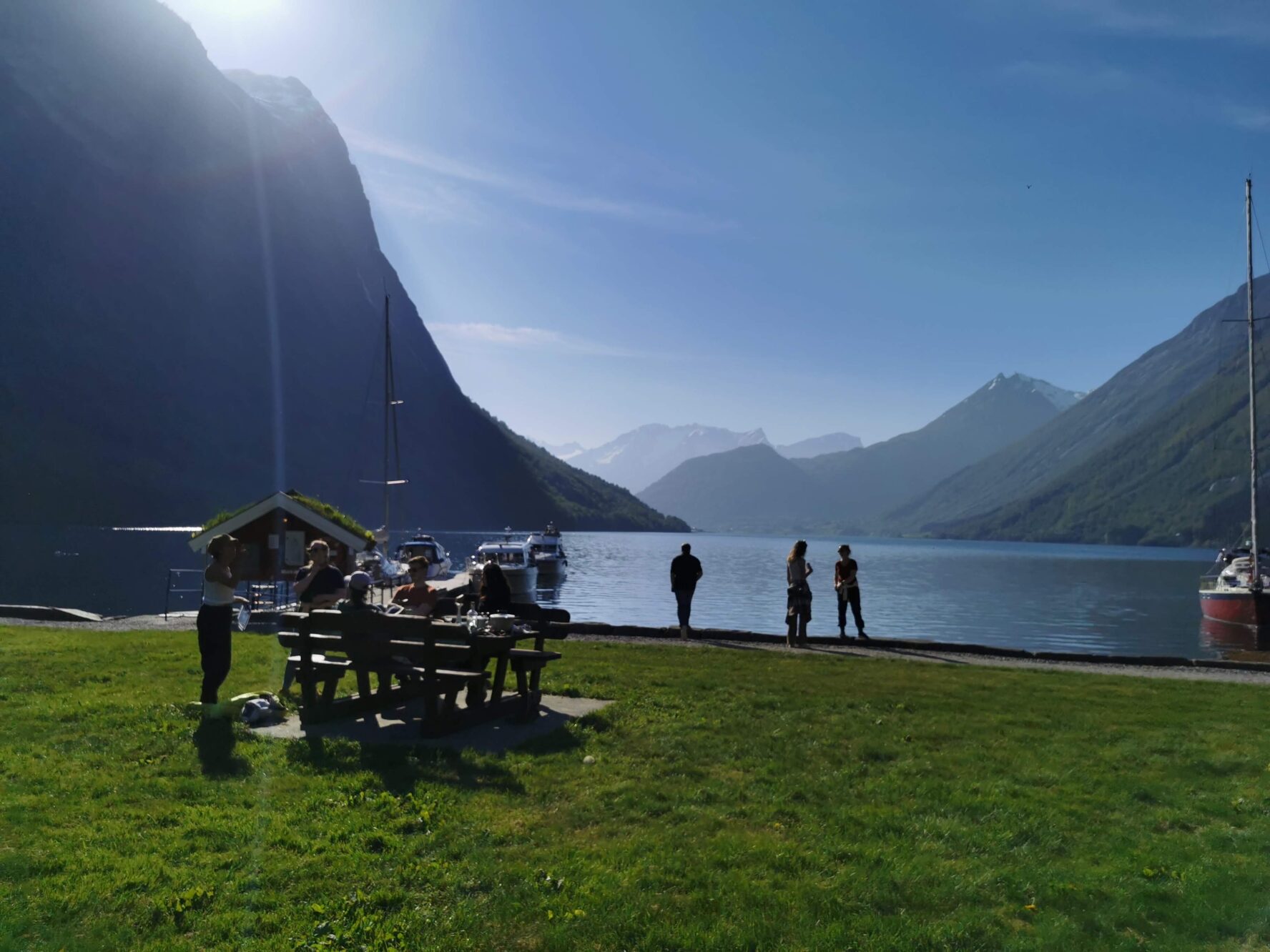 Adventurers having a picnic in a fjord, Norway
