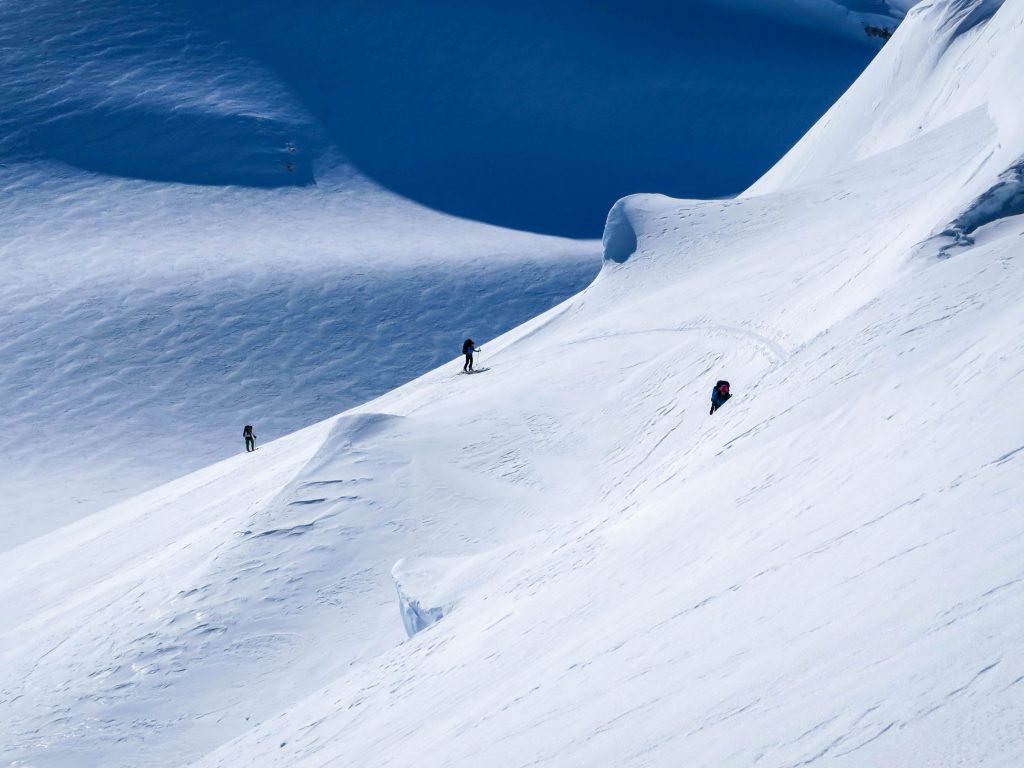 Ski mountaineers ski touring on Garibaldi Neve Traverse