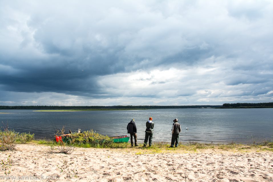 Three men at the Hawkrock River