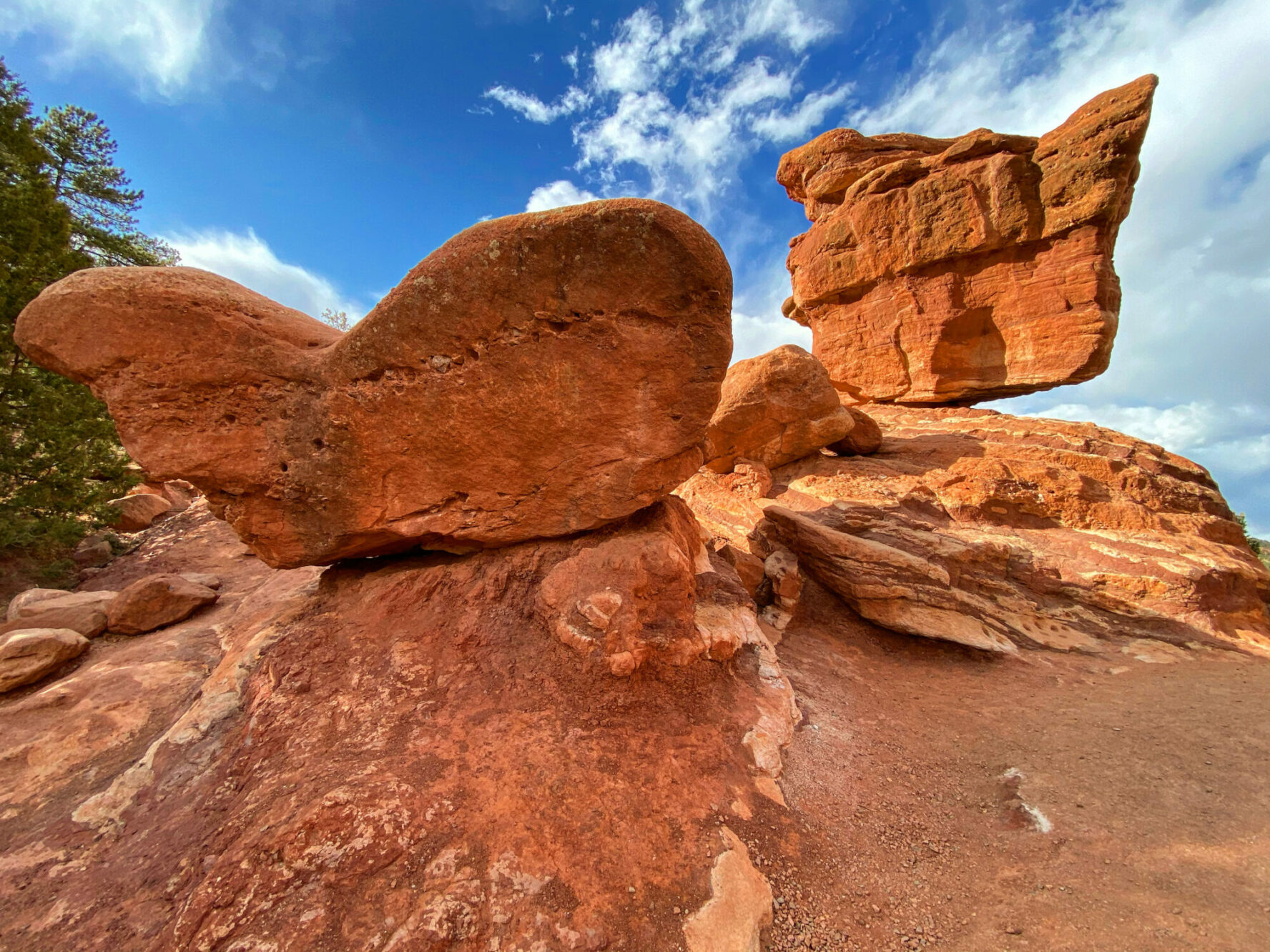 Balance rock rises 35 feet above its pedestal base, and it weighs approximately 1.4 million pounds.