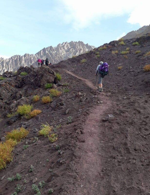 A hiker going uphill on the Sham Valley trek