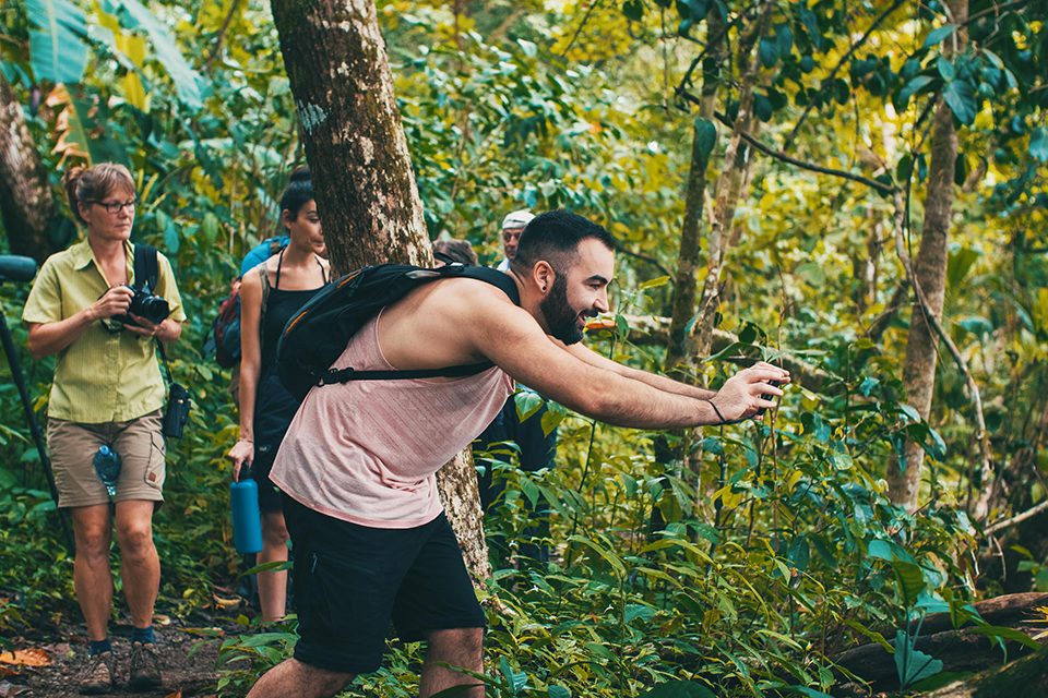 An excited hiker taking a picture of wildlife