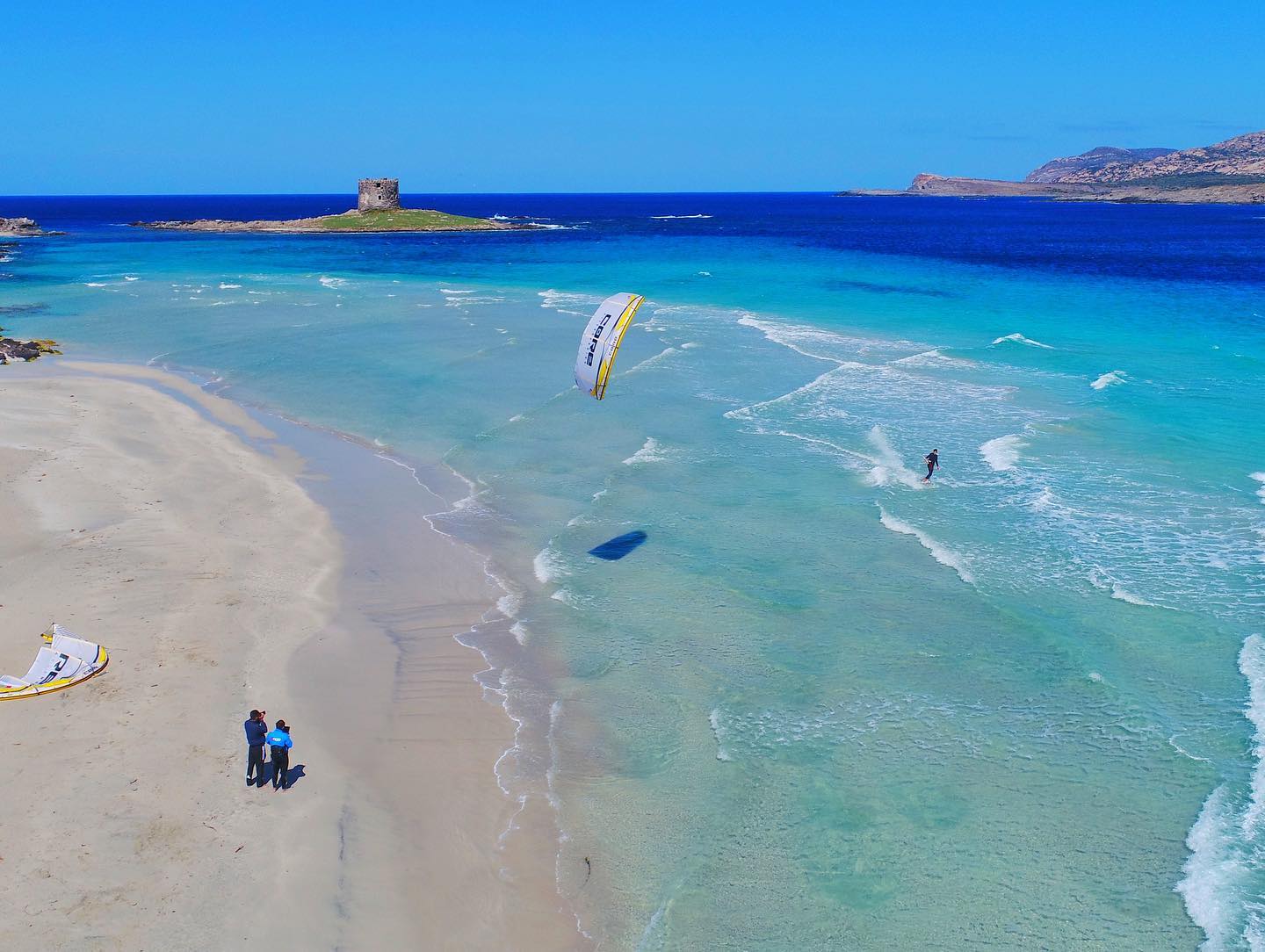 A kitesurfer in Sardinia on a sunny day