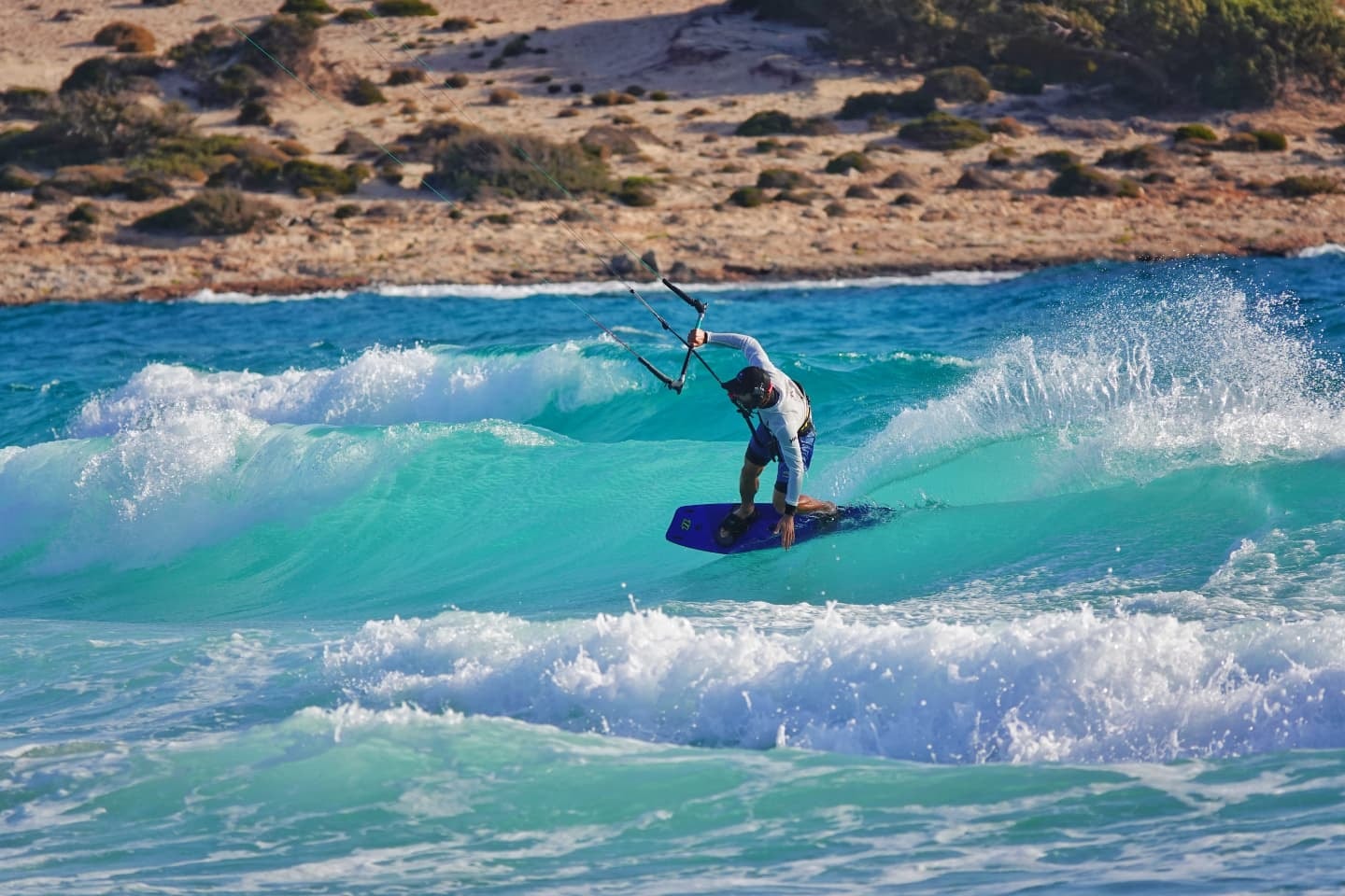 A kitesurfer on waves in the Cyclades, Greece