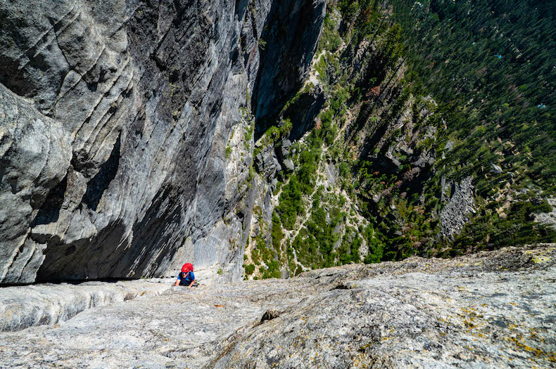 A climber in a crack shot from overhead in Lake Tahoe