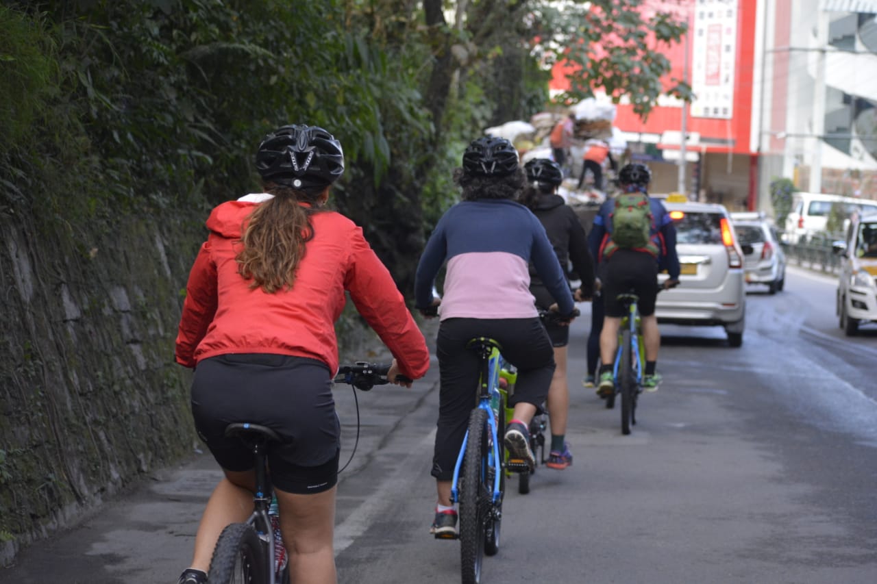 Mountain bikers and cars in Sikkim