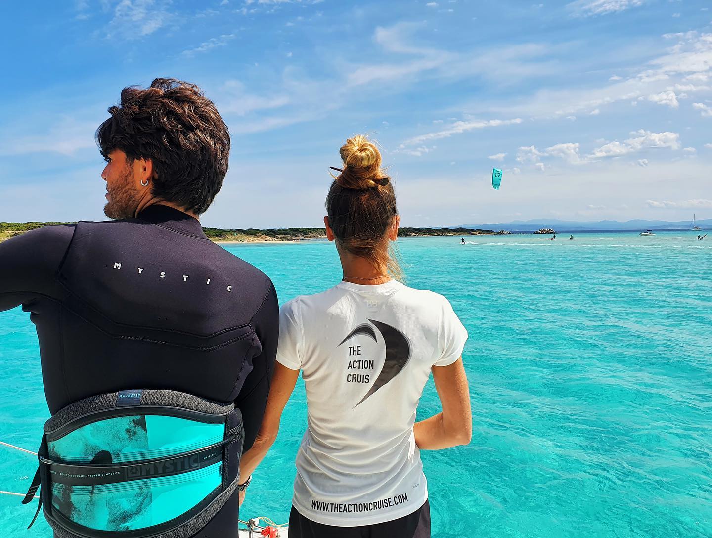 People watching kitesurfers in Sardinia