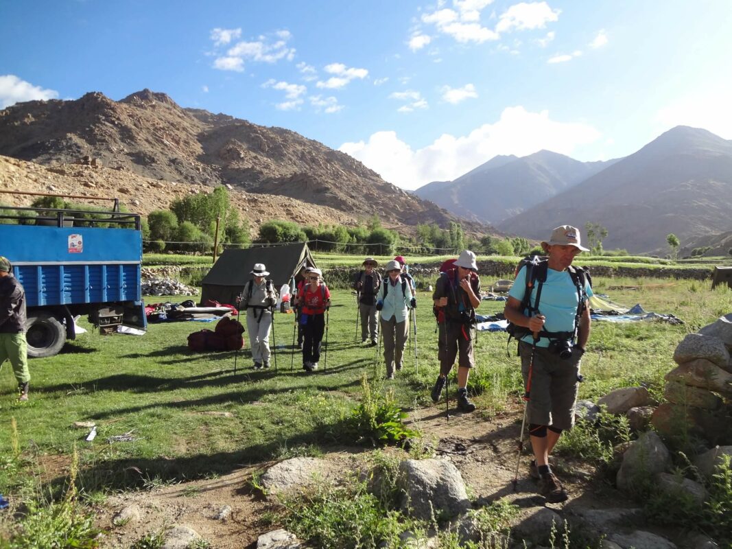 Trekkers on a grass surface, the Markha Valley trek