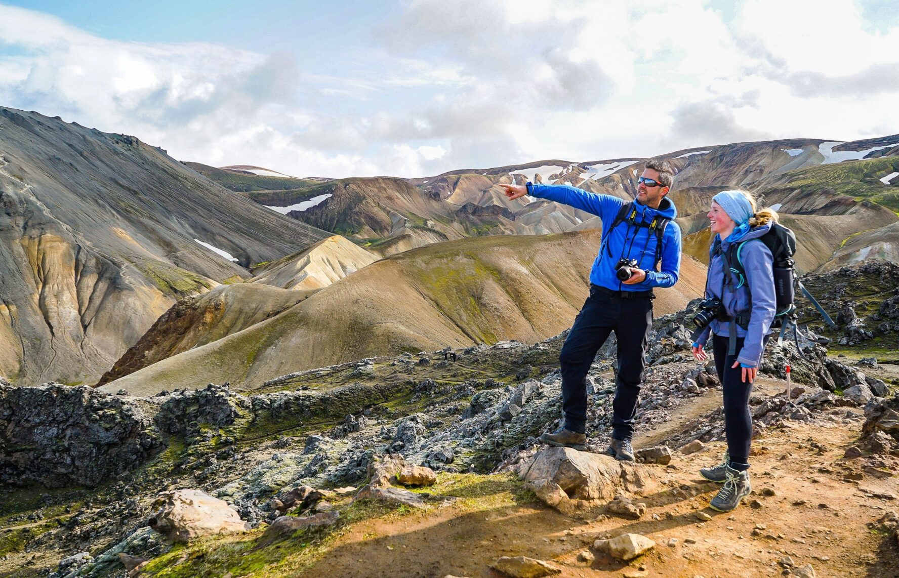 Two hikers looking at the scenery of Iceland