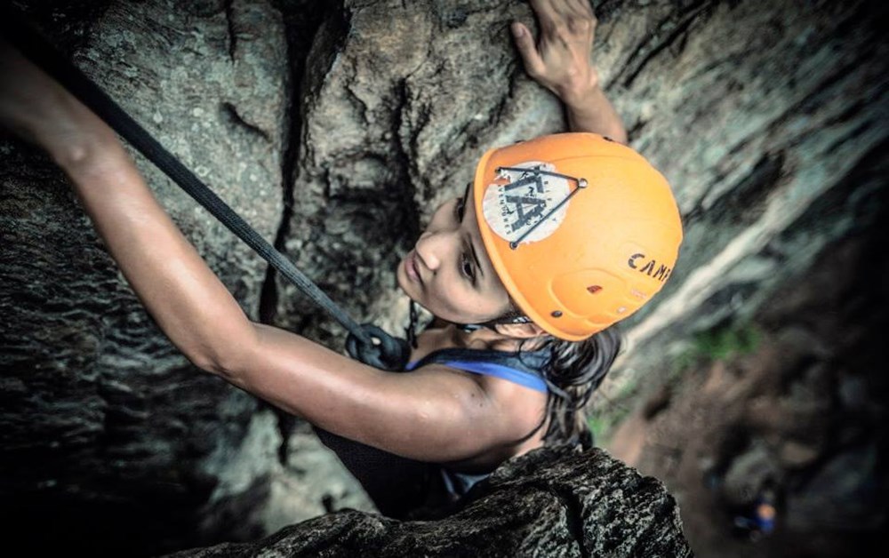A woman rock climbing in North Carolina