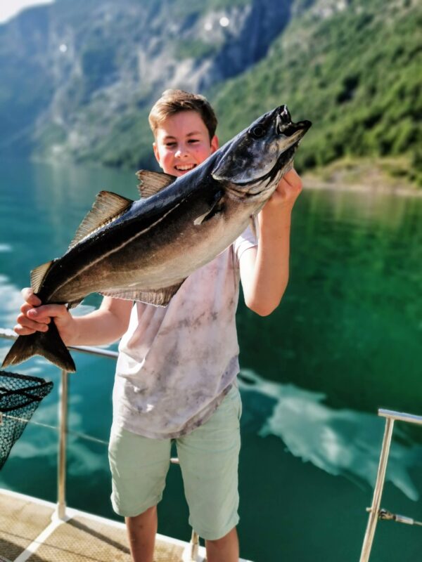 A kid with a fish in Norway