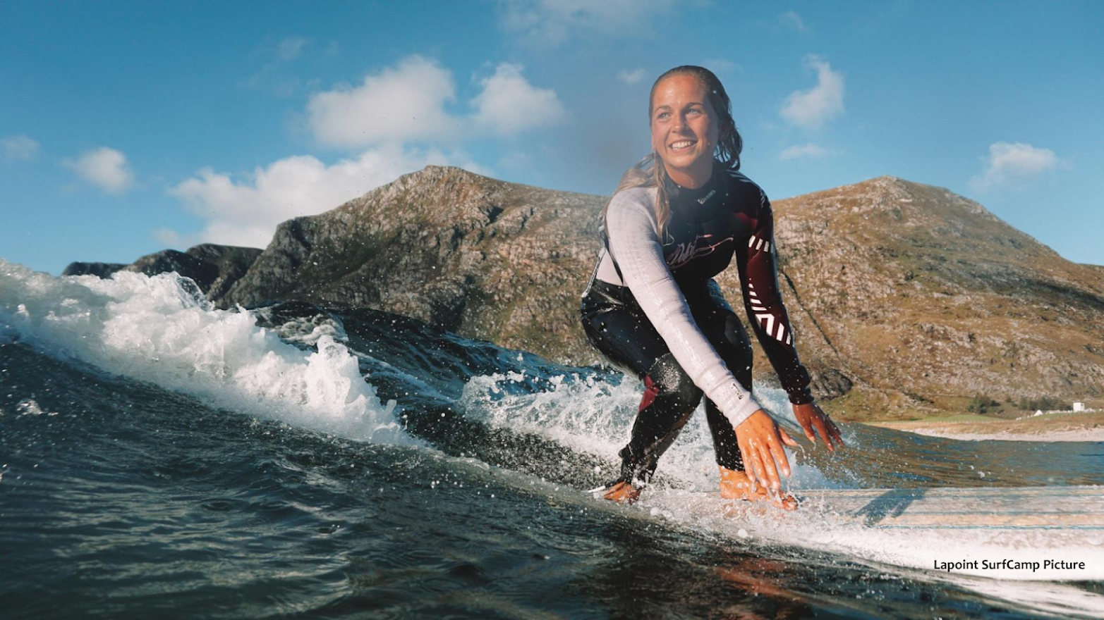 A female surfer enjoying her time in Norway