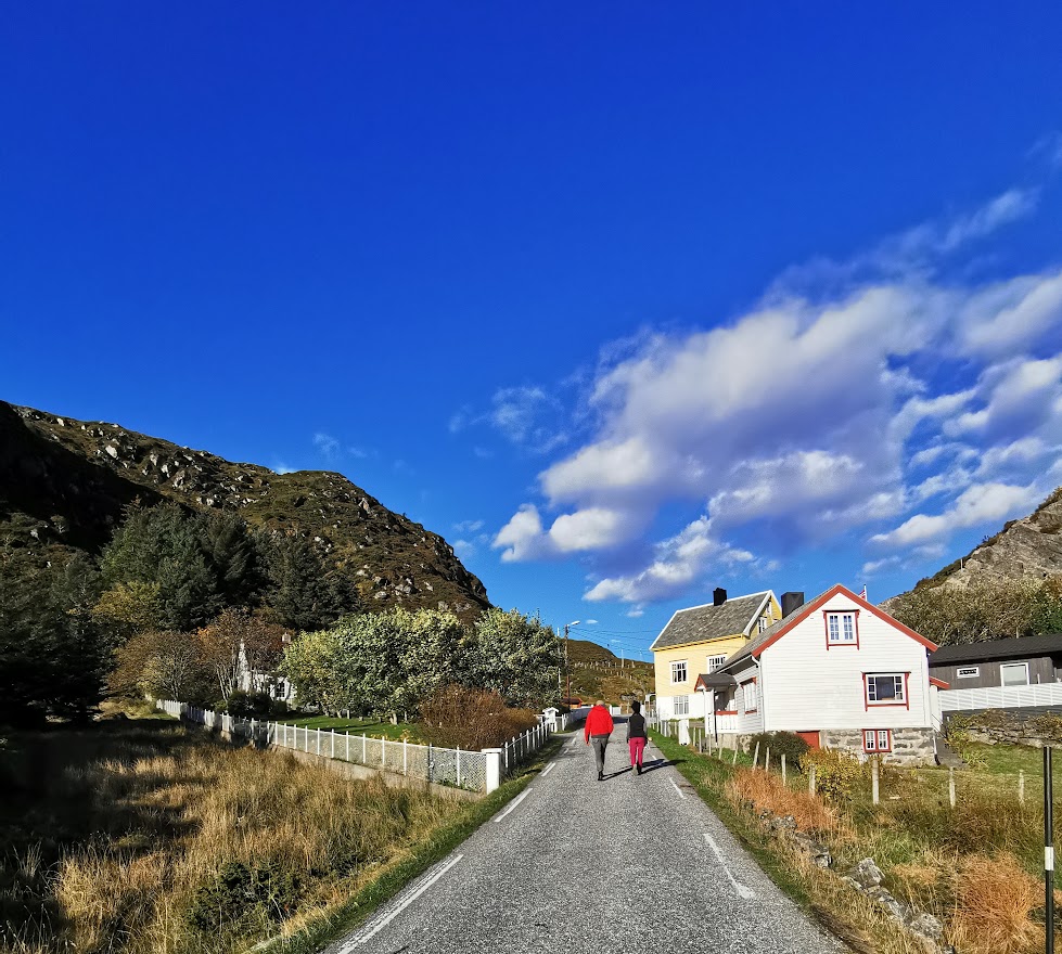 Hikers entering a small town in Norway