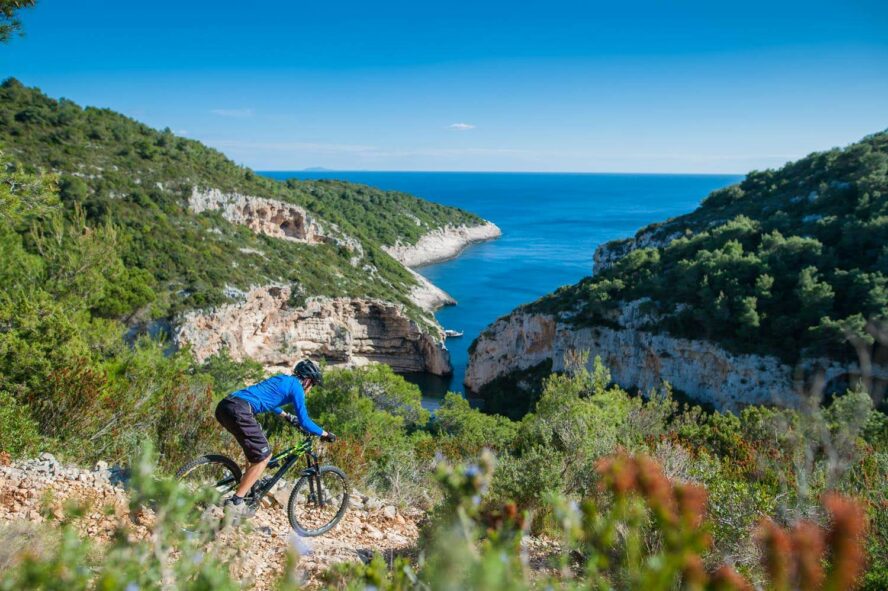 A mountain biker meanders through the island of Vis. 