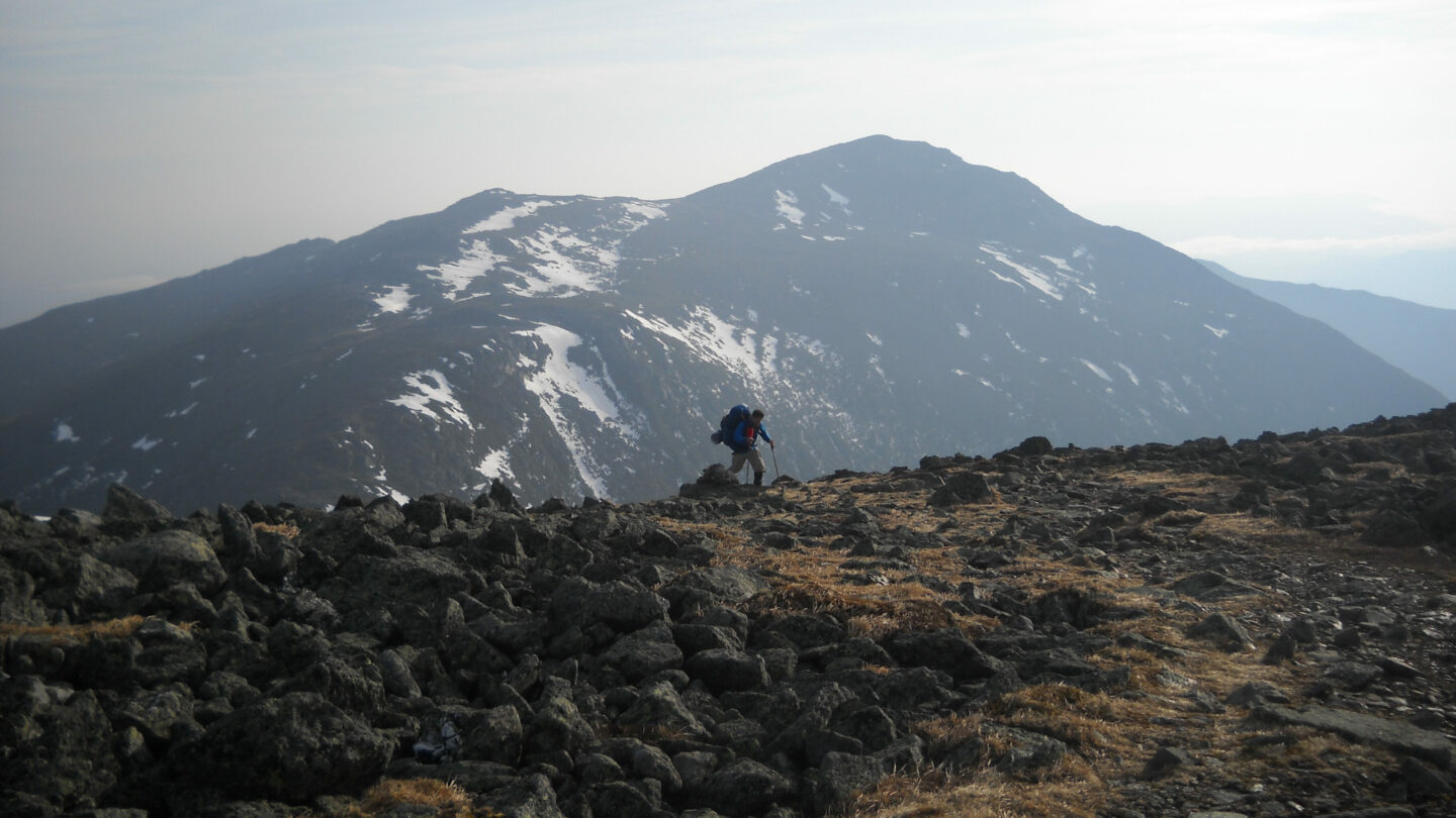 Hiker along the Presidential Traverse in New Hampshire, which strings together several summits above 4,000 feet.