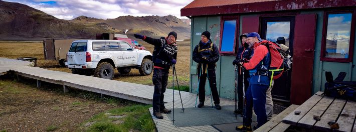 A group of hikers conversing about their plans for today's hike