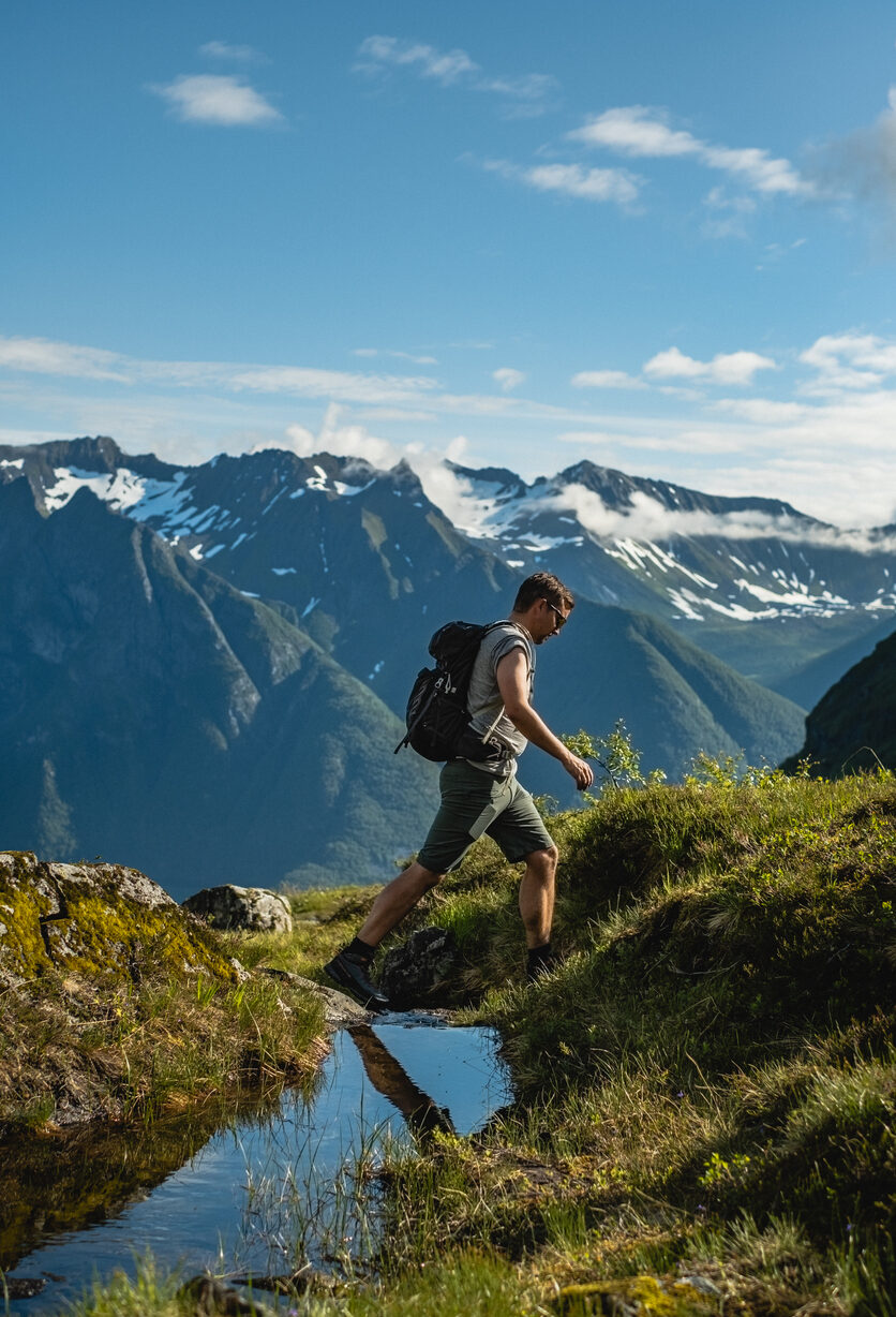 Man overlooking fjord in Sunnmore, Norway.