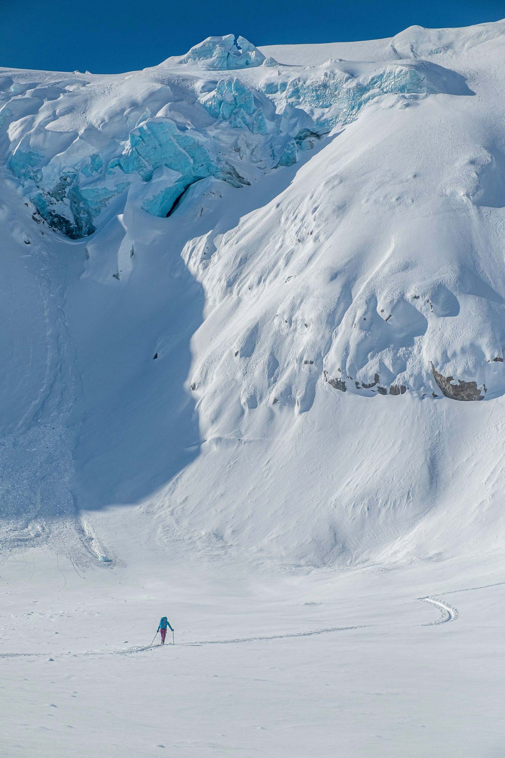 One backcountry skier on fresh snow.