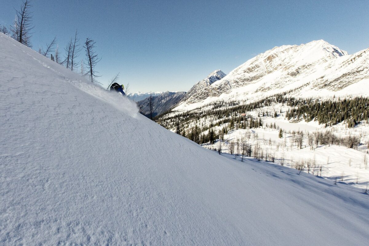 Purcell Mountains and a skier