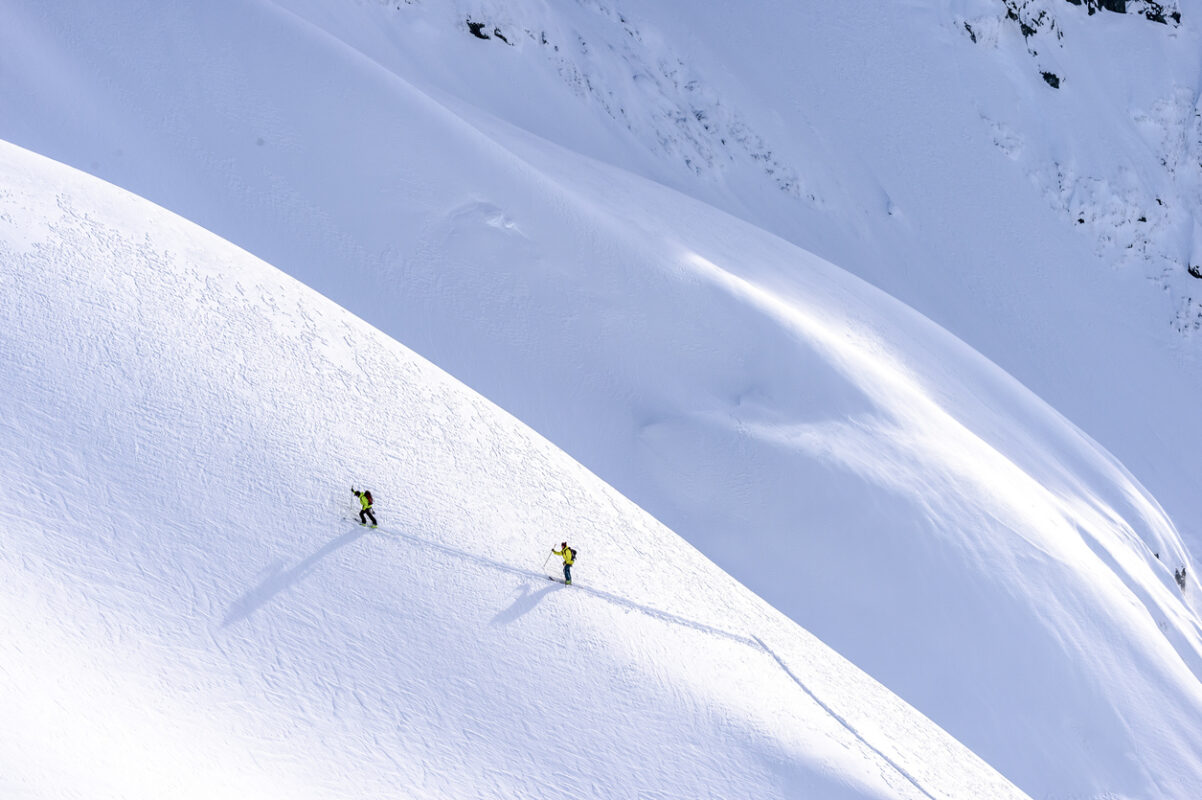 Two backcountry skiers going up the Range.