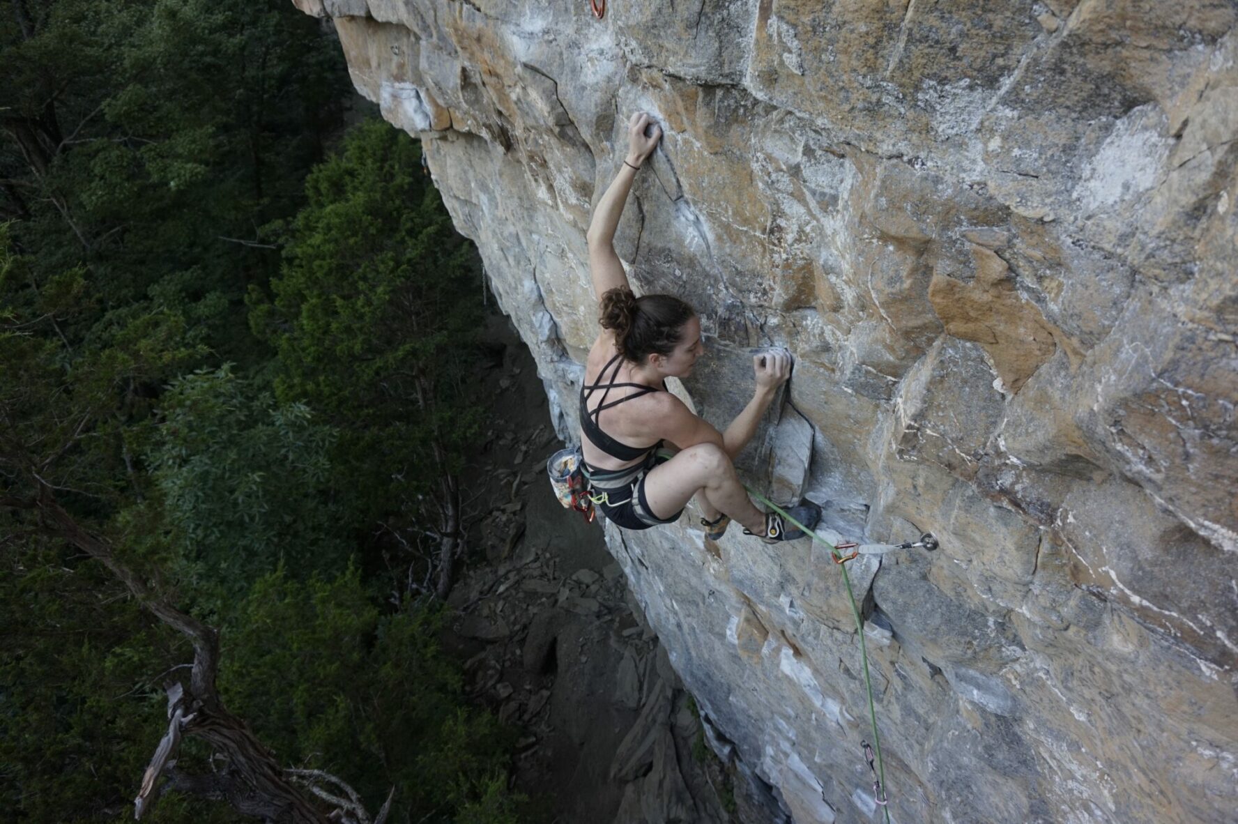 The author climbs Flash Fried (5.12b) at Buffet Wall in Denny Cove.