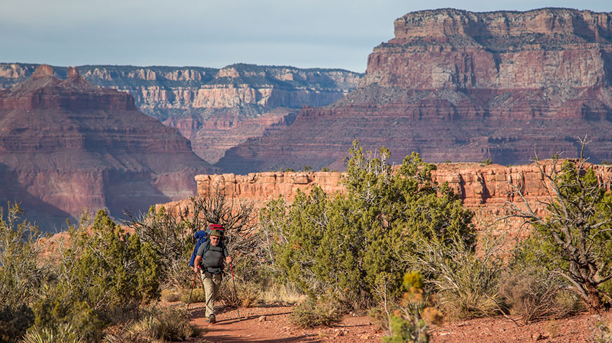 A hiker on a plateau on the Grandview Trek
