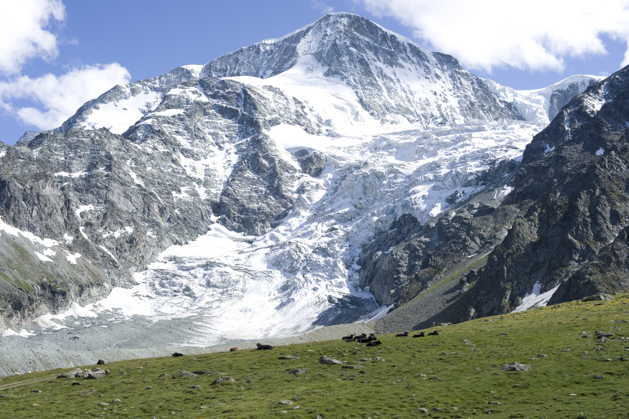 Glaciated mountain in the Swiss Alps, seen during the Haute Route, Pigne d’Arolla.