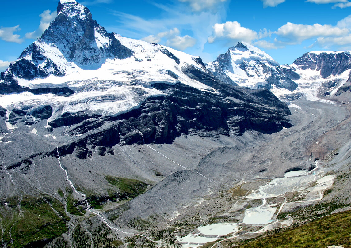Zmutt valley and glacier surrounded by glaciated peaks, a sublime landscape in the Swiss Alps.