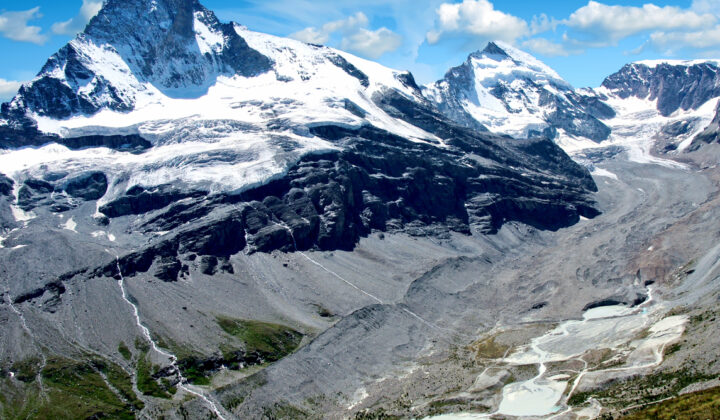 Zmutt valley and glacier surrounded by glaciated peaks, a sublime landscape in the Swiss Alps.